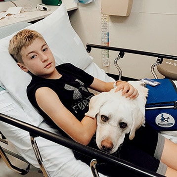 Dog comforts kids in emergency room - Arlington Catholic Herald