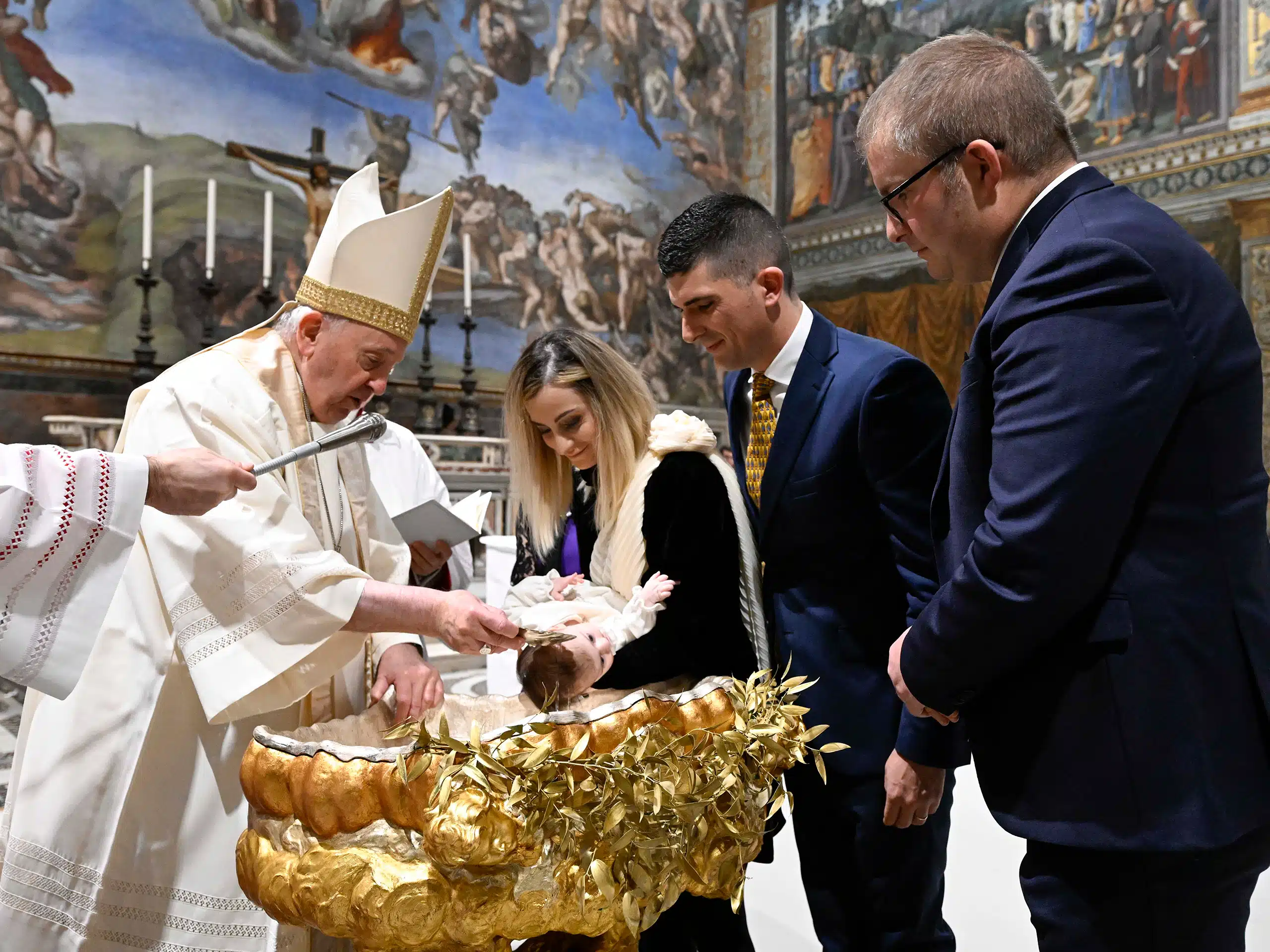 Pope baptizes babies, urges parents to teach them to pray Arlington